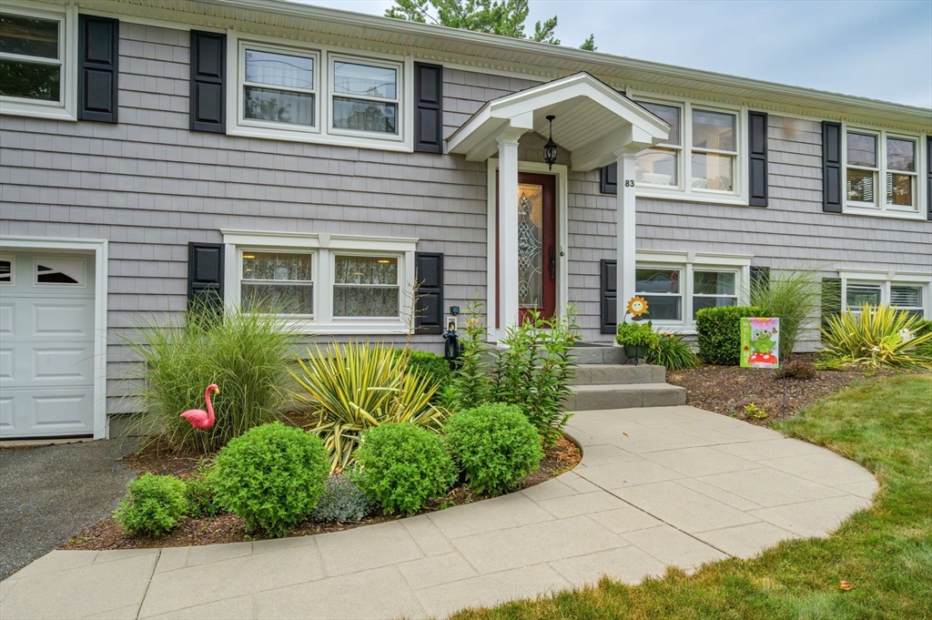 83 Loomis Drive Chicopee, MA 01020 - Photo 2 of 40 a front view of a house with garden