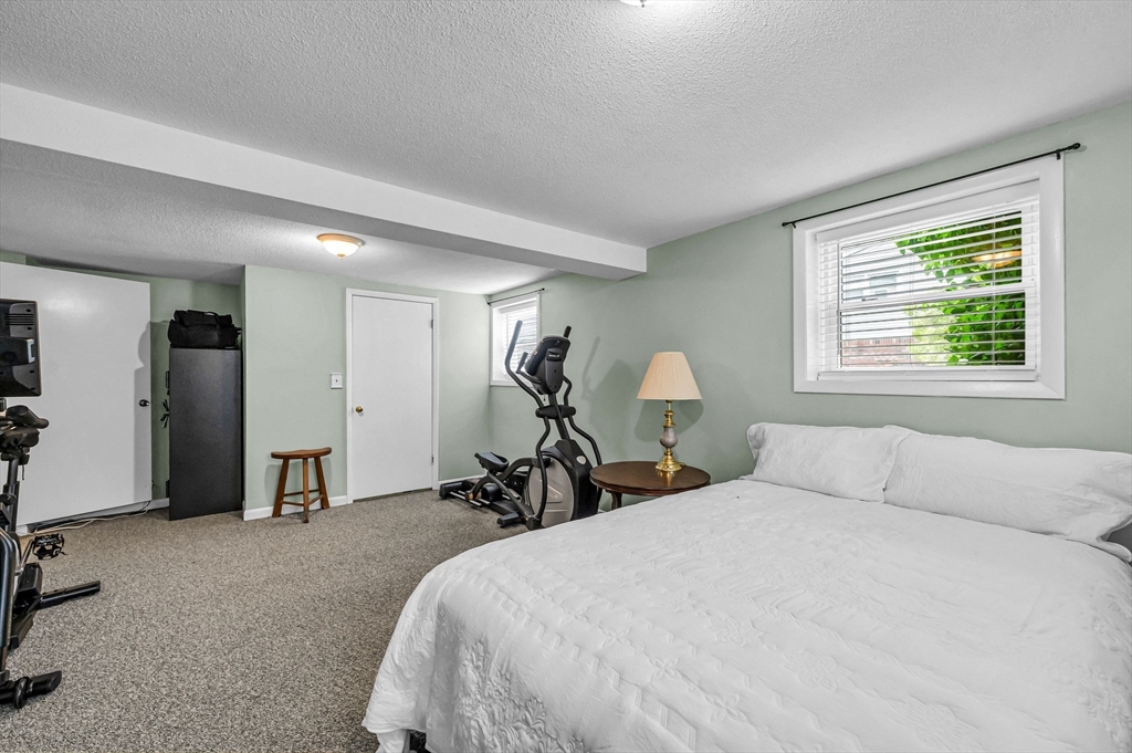 83 Loomis Drive Chicopee, MA 01020 - Photo 21 of 40 a bedroom with a bed and a window