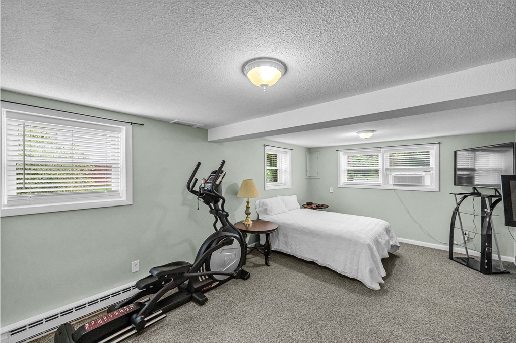 83 Loomis Drive Chicopee, MA 01020 - Photo 22 of 40 a room with a bed and a desk