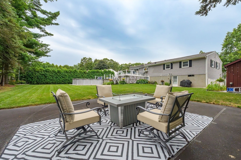 83 Loomis Drive Chicopee, MA 01020 - Photo 34 of 40 a view of a patio with chair and table