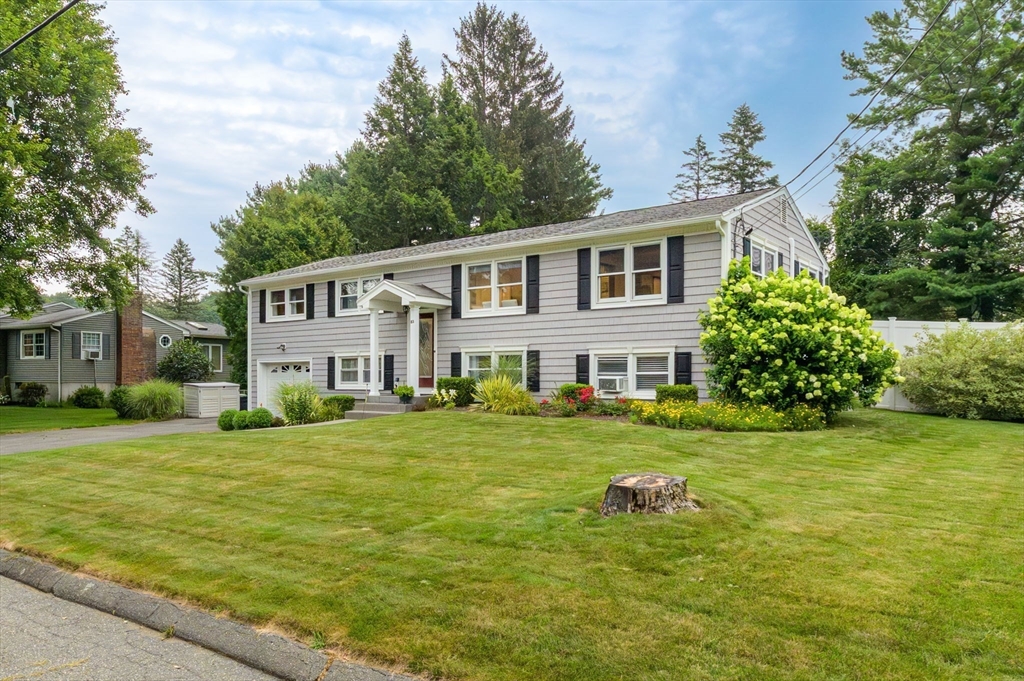 83 Loomis Drive Chicopee, MA 01020 - Photo 37 of 40 a front view of a house with garden