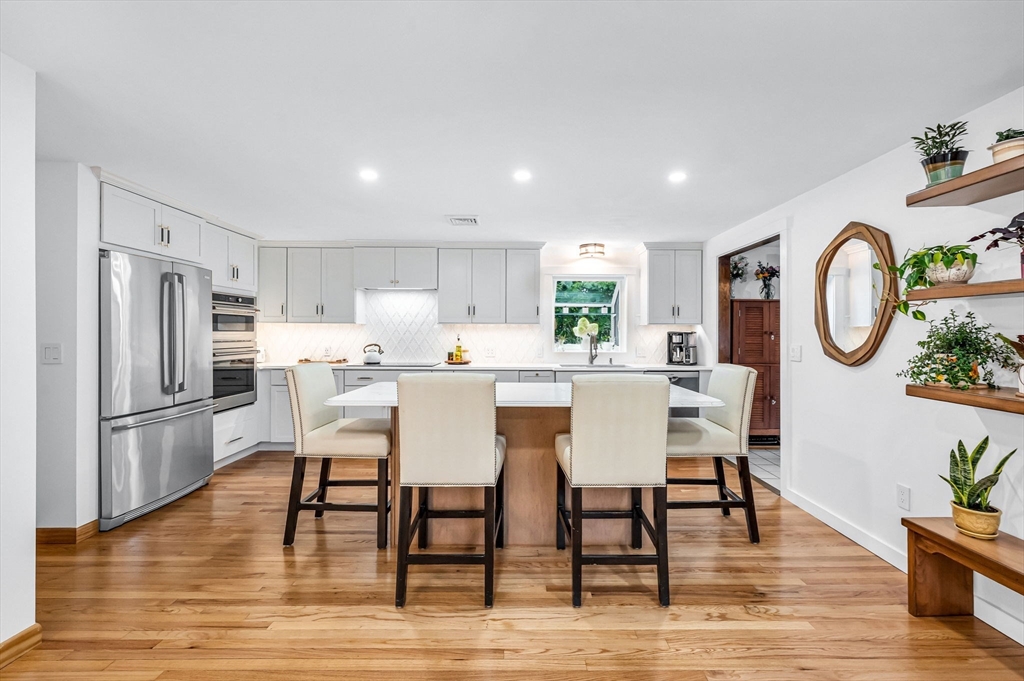 83 Loomis Drive Chicopee, MA 01020 - Photo 9 of 40 a dining room with furniture a window and a view of kitchen