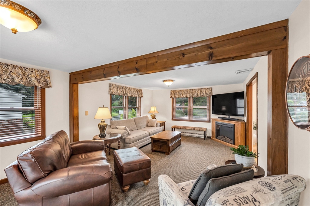 83 Loomis Drive Chicopee, MA 01020 - Photo 10 of 40 a living room with furniture and a flat screen tv