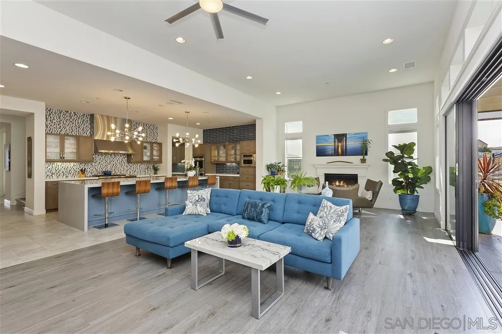 4702 Crespi Court Carlsbad, CA 92010 - Photo 11 of 39 a living room with furniture and a fireplace