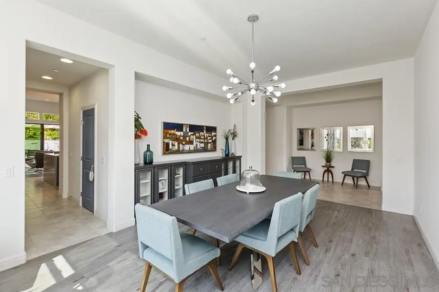 4702 Crespi Court Carlsbad, CA 92010 - Photo 15 of 39 a view of a dining room with furniture and wooden floor