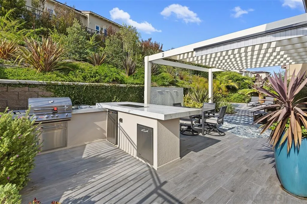 4702 Crespi Court Carlsbad, CA 92010 - Photo 17 of 39 a view of kitchen with seating area and barbeque oven