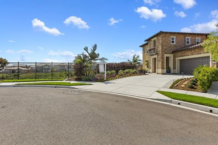 4702 Crespi Court Carlsbad, CA 92010 - Photo 2 of 39 a view of a house with a big yard and potted plants