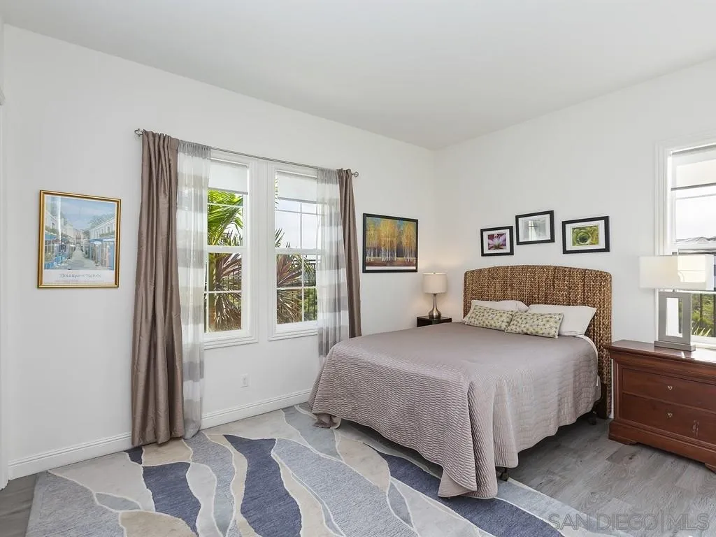 4702 Crespi Court Carlsbad, CA 92010 - Photo 24 of 39 a bedroom with a large bed and a window