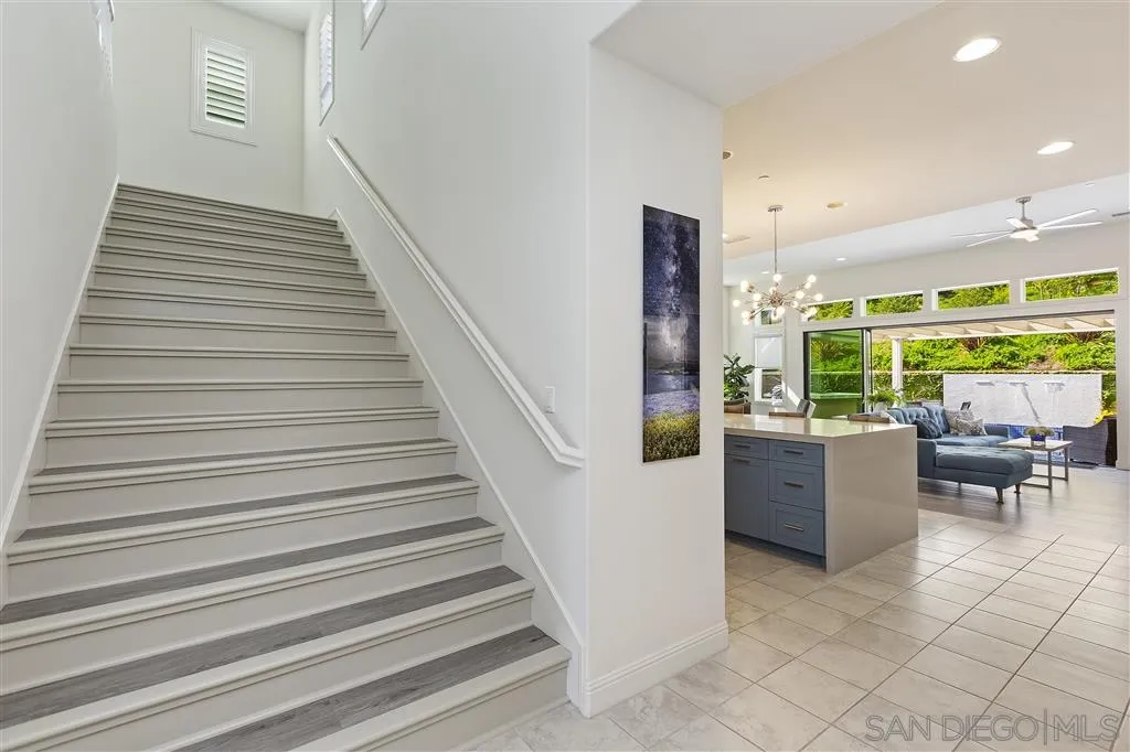 4702 Crespi Court Carlsbad, CA 92010 - Photo 27 of 39 a view of entryway and hall with wooden floor