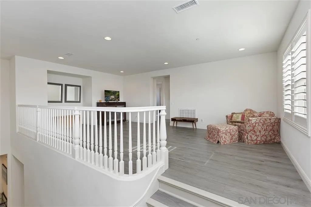 4702 Crespi Court Carlsbad, CA 92010 - Photo 28 of 39 a bedroom with furniture and baby crib