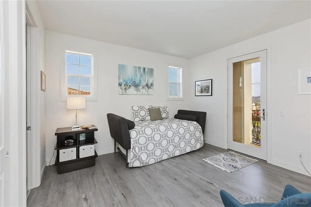 4702 Crespi Court Carlsbad, CA 92010 - Photo 29 of 39 a bedroom with bed and a window
