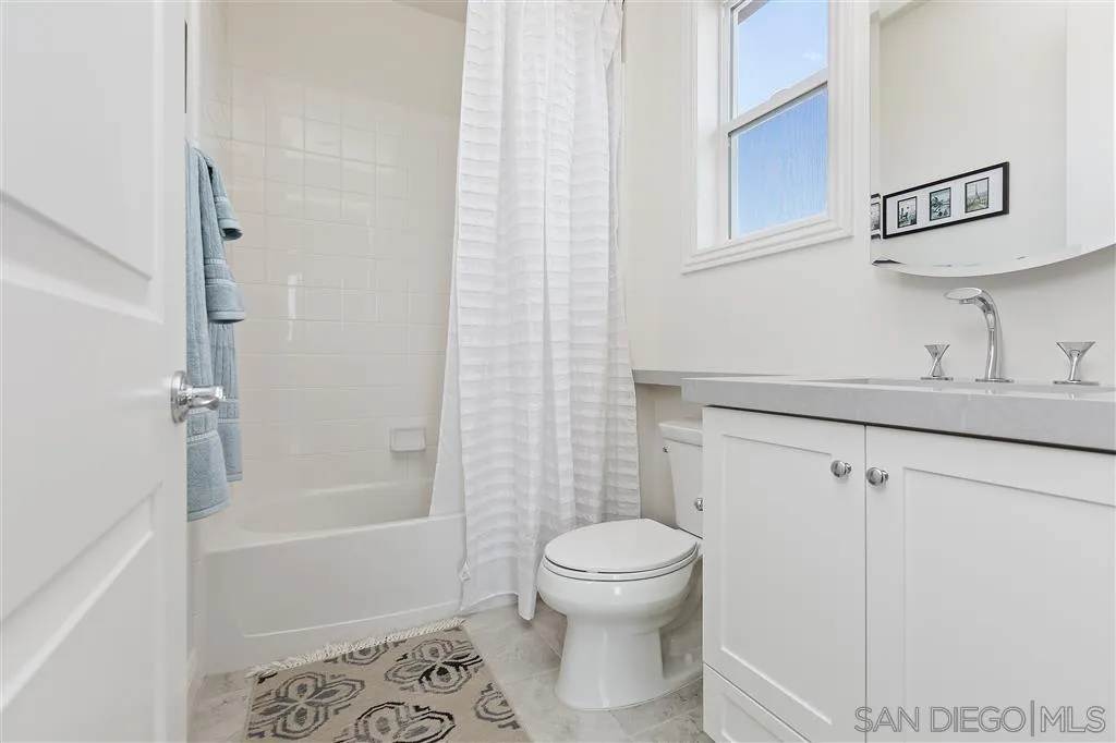 4702 Crespi Court Carlsbad, CA 92010 - Photo 30 of 39 a bathroom with a toilet sink and shower