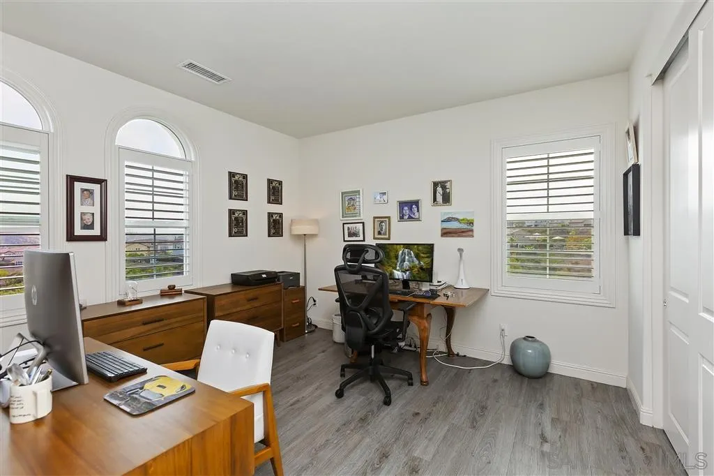 4702 Crespi Court Carlsbad, CA 92010 - Photo 31 of 39 a view of a workspace with furniture and a window