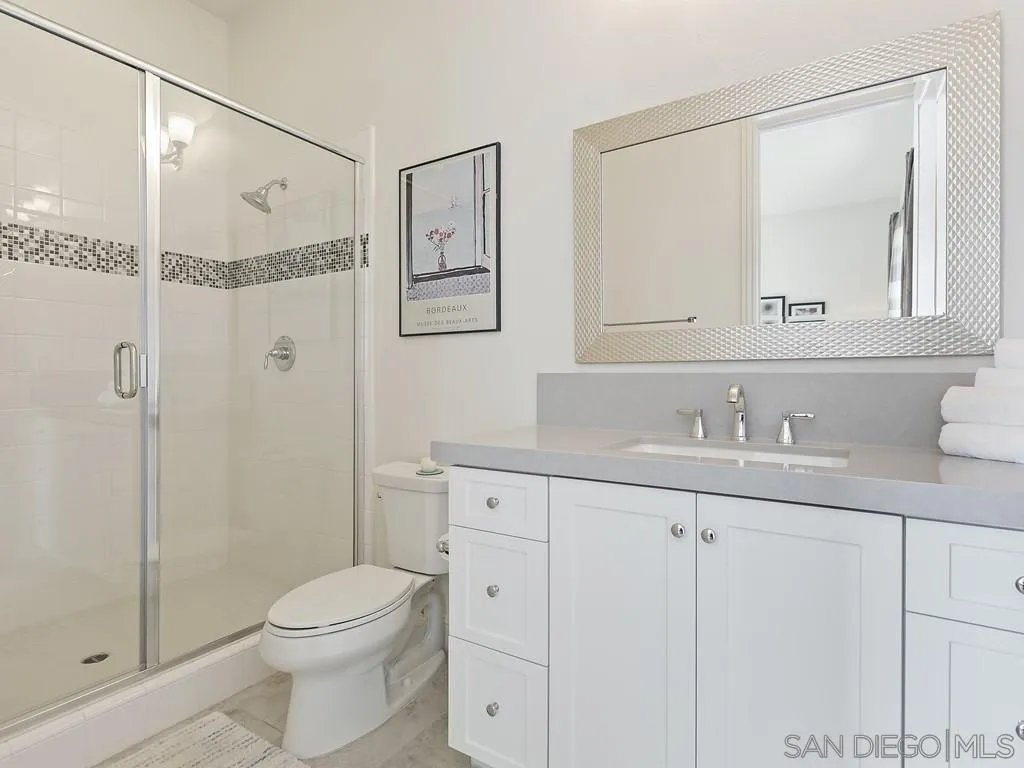 4702 Crespi Court Carlsbad, CA 92010 - Photo 32 of 39 a bathroom with a sink a toilet and shower
