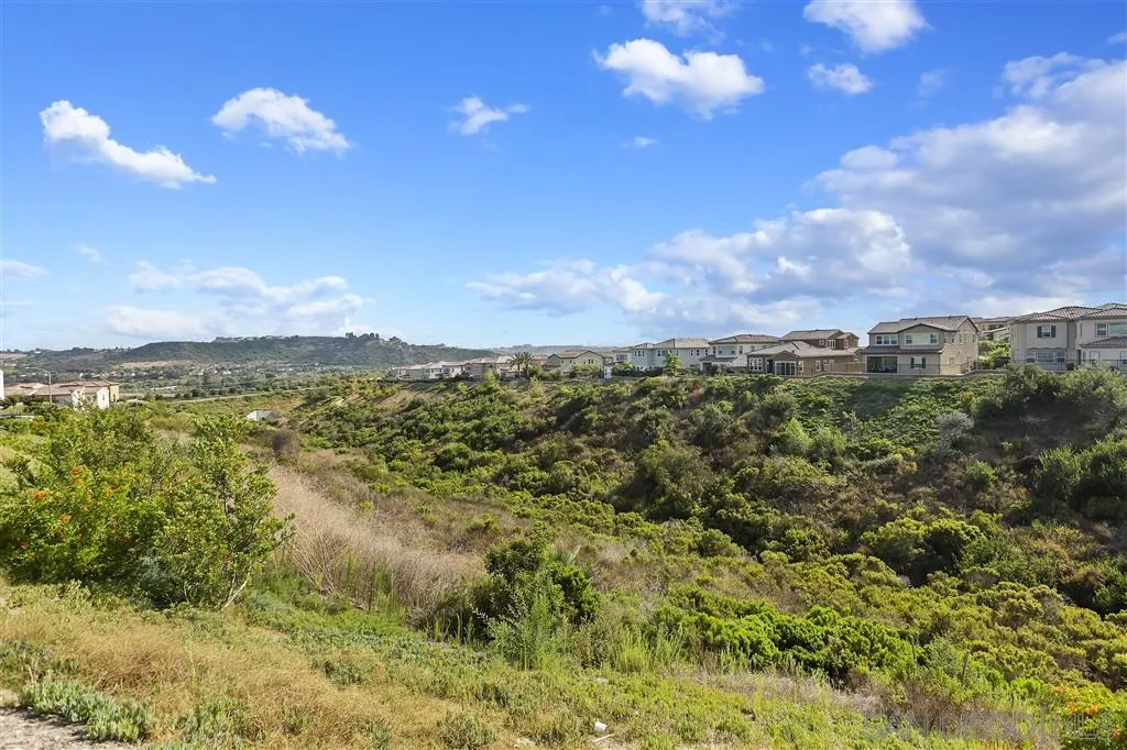 4702 Crespi Court Carlsbad, CA 92010 - Photo 36 of 39 a view of a lake in between of two buildings