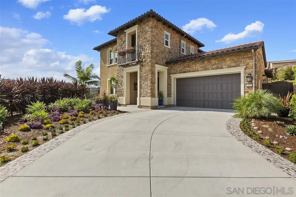 4702 Crespi Court Carlsbad, CA 92010 - Photo 39 of 39 a front view of a house with a yard and garage