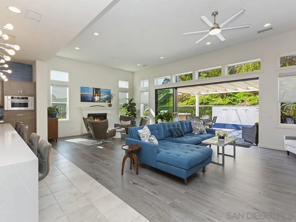 4702 Crespi Court Carlsbad, CA 92010 - Photo 4 of 39 a living room with furniture and a large window with wooden floor