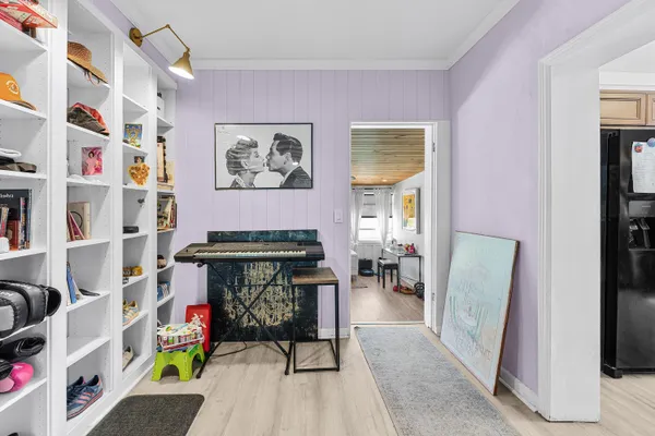 a room with furniture and a book shelf