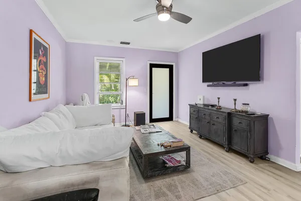 a living room with furniture and a flat screen tv