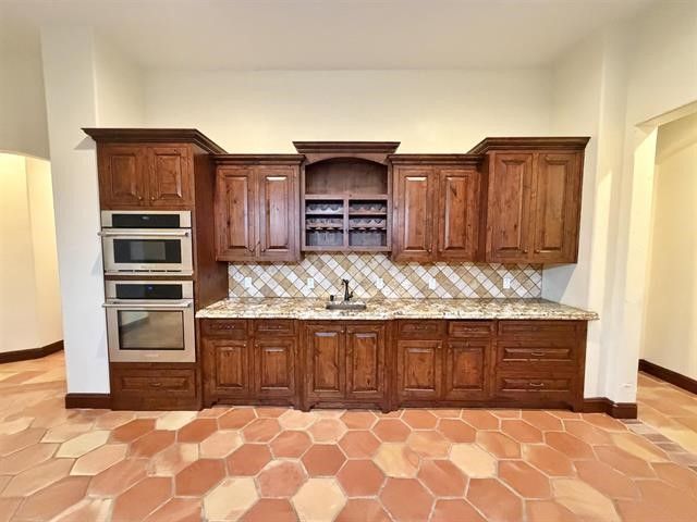 12410 Keith Road Beaumont, TX 77713 - Photo 10 of 45 a view of kitchen with wooden cabinet