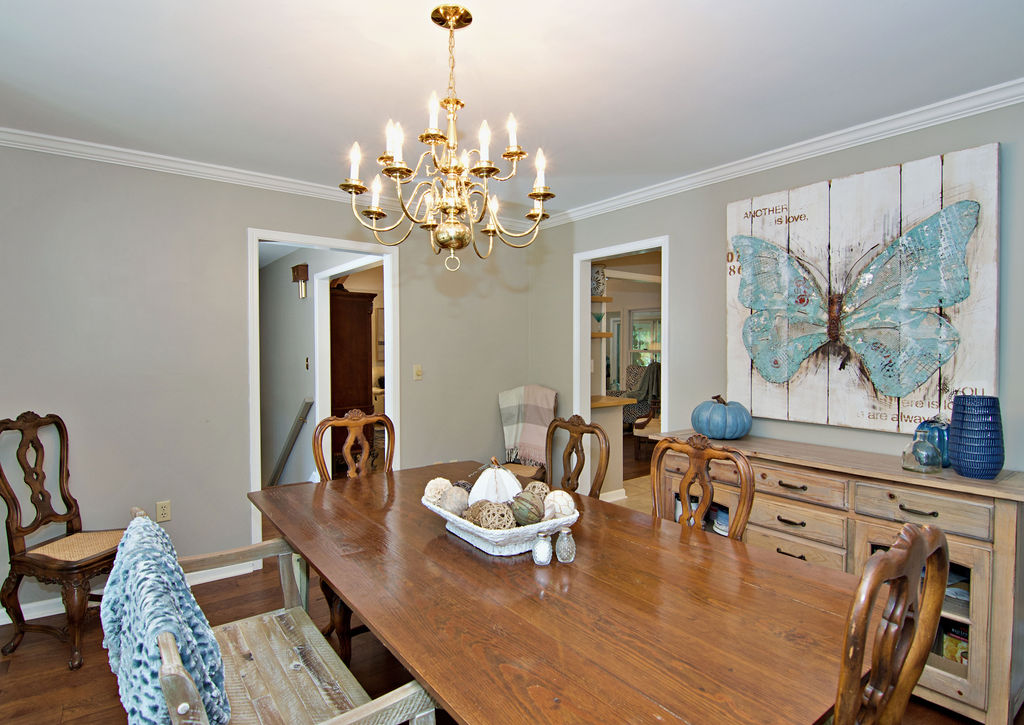 11001 Lake Ridge Lane Seneca, SC 29672 - Photo 16 of 50 Crown molding frames the ceiling above rich wood flooring in this inviting dining space.