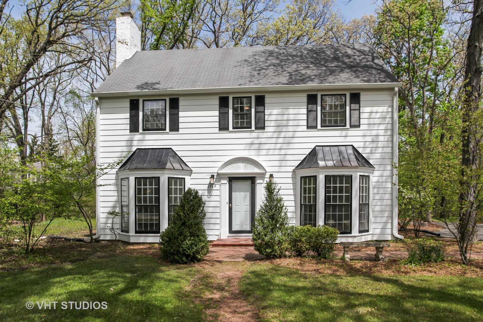 1729 Berkeley Road Highland Park, IL 60035 - Photo 1 of 25 a front view of a house with a yard