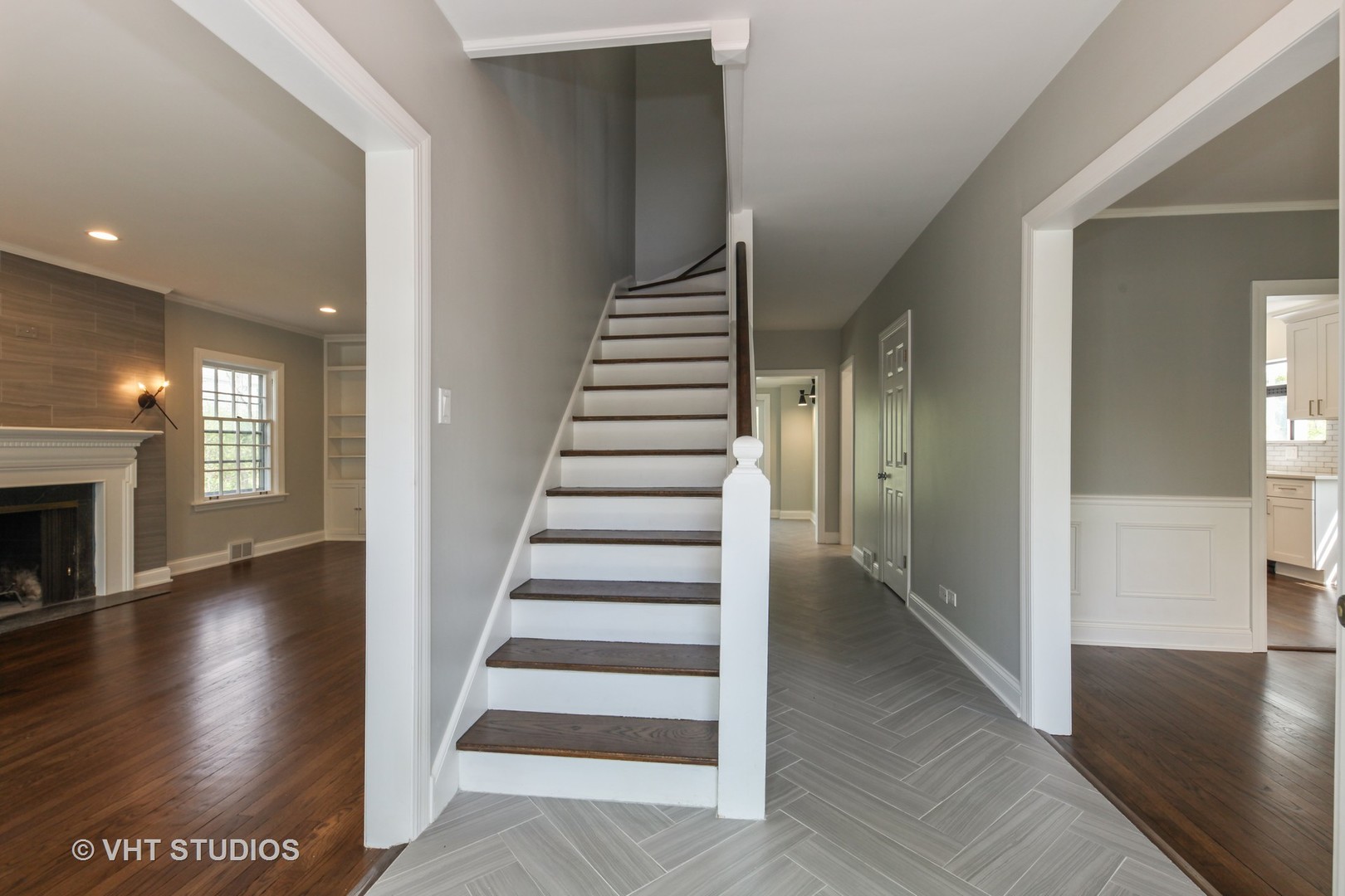 1729 Berkeley Road Highland Park, IL 60035 - Photo 2 of 25 a view of an entryway with wooden floor and stairs