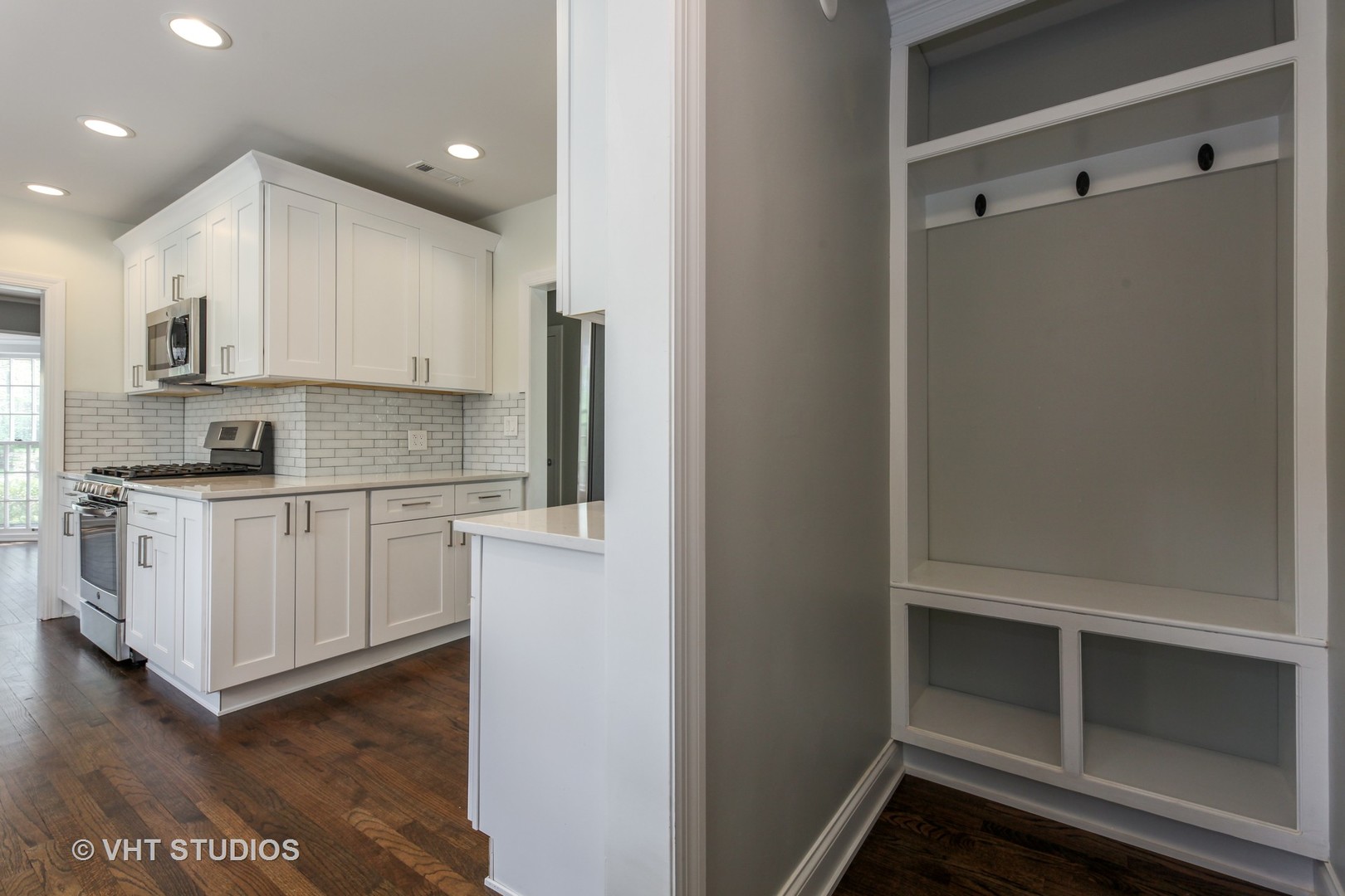 1729 Berkeley Road Highland Park, IL 60035 - Photo 13 of 25 a kitchen with white cabinets and white appliances