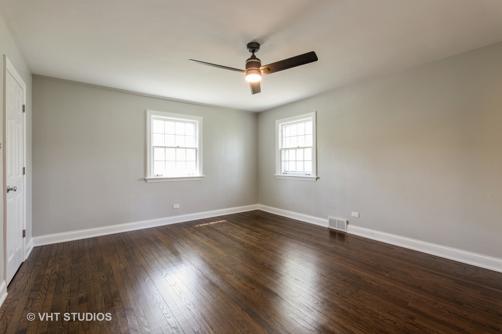1729 Berkeley Road Highland Park, IL 60035 - Photo 14 of 25 an empty room with wooden floor and windows