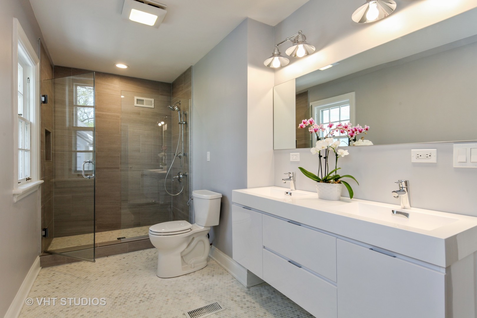 1729 Berkeley Road Highland Park, IL 60035 - Photo 15 of 25 a bathroom with a sink toilet and shower