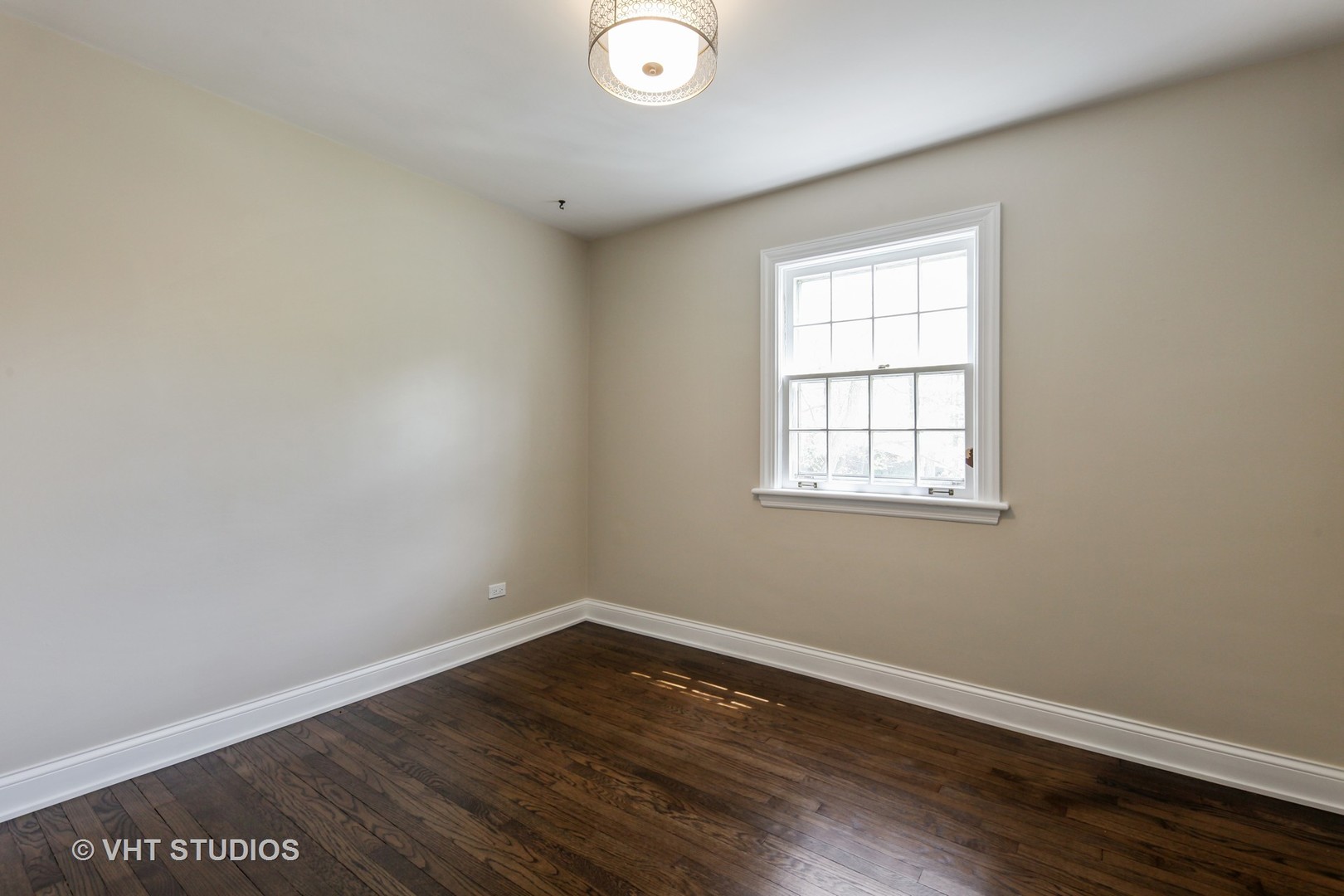 1729 Berkeley Road Highland Park, IL 60035 - Photo 17 of 25 wooden floor in an empty room with a window