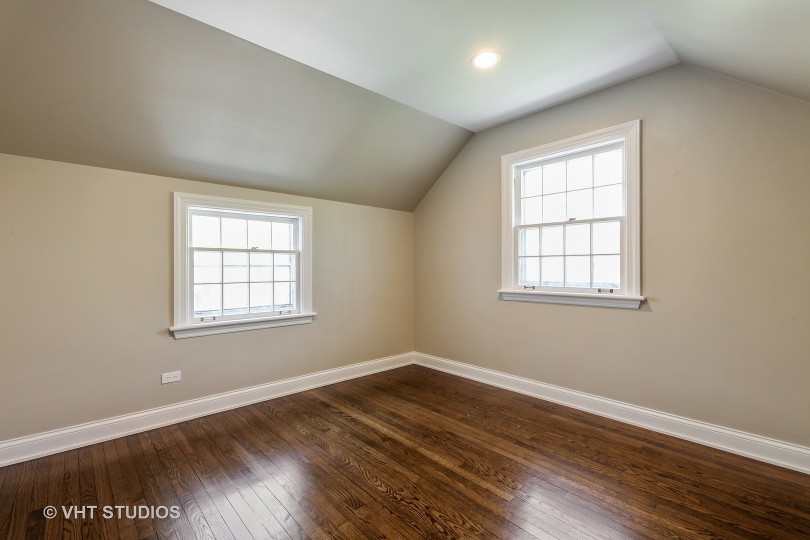 1729 Berkeley Road Highland Park, IL 60035 - Photo 18 of 25 an empty room with wooden floor and windows