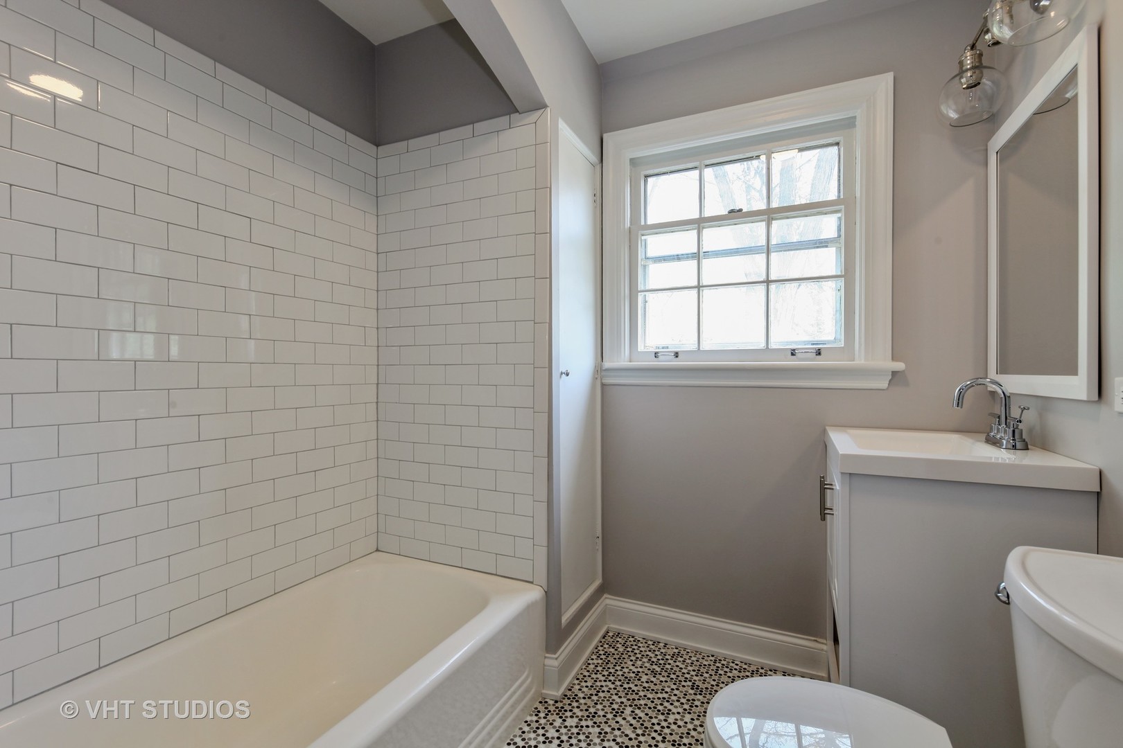 1729 Berkeley Road Highland Park, IL 60035 - Photo 19 of 25 a bathroom with a sink a toilet and shower