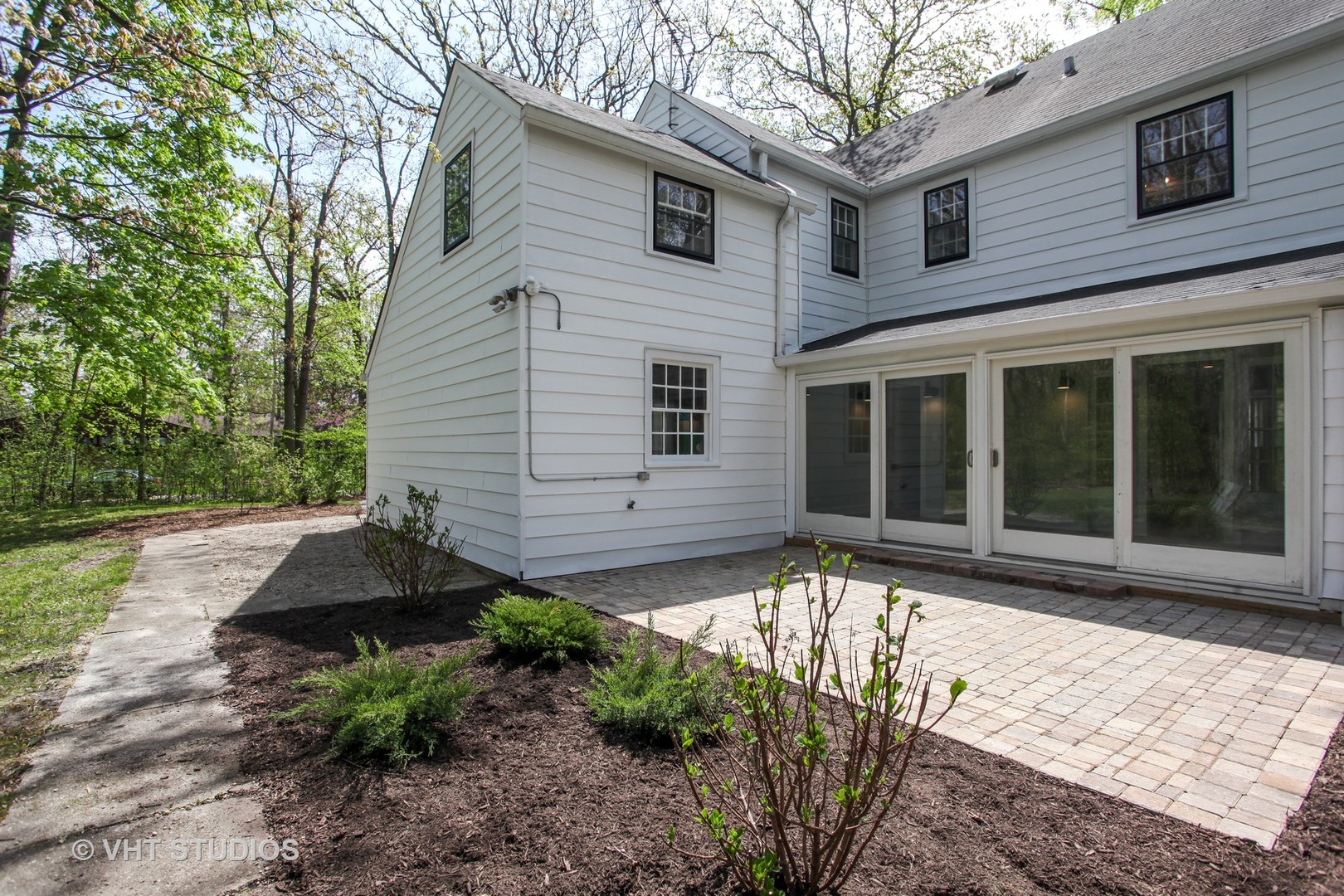 1729 Berkeley Road Highland Park, IL 60035 - Photo 22 of 25 a front view of a house with garden