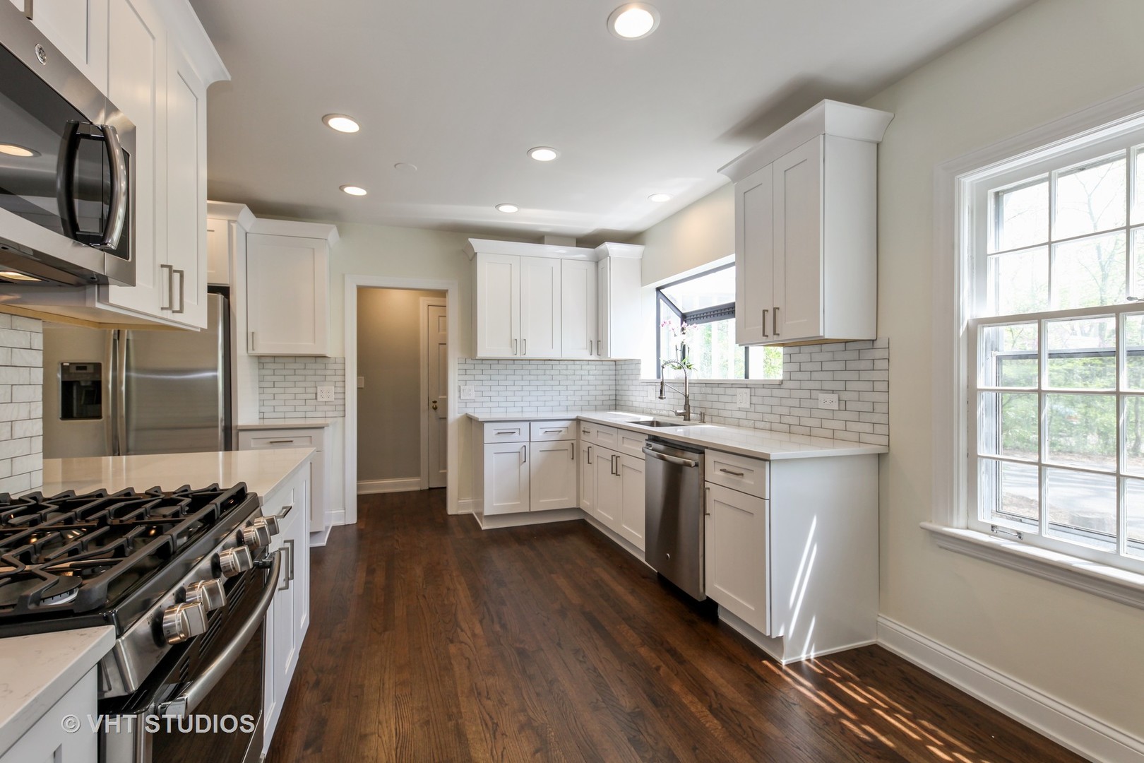 1729 Berkeley Road Highland Park, IL 60035 - Photo 6 of 25 a large kitchen with stainless steel appliances granite countertop a stove a sink dishwasher and a refrigerator