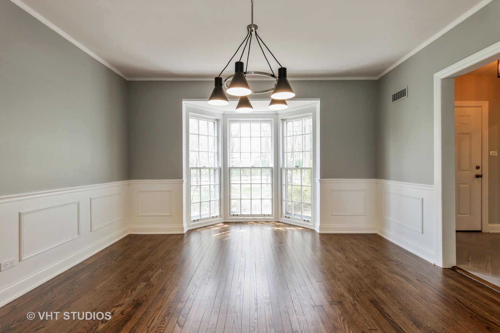 1729 Berkeley Road Highland Park, IL 60035 - Photo 7 of 25 a view of an empty room with wooden floor and a window