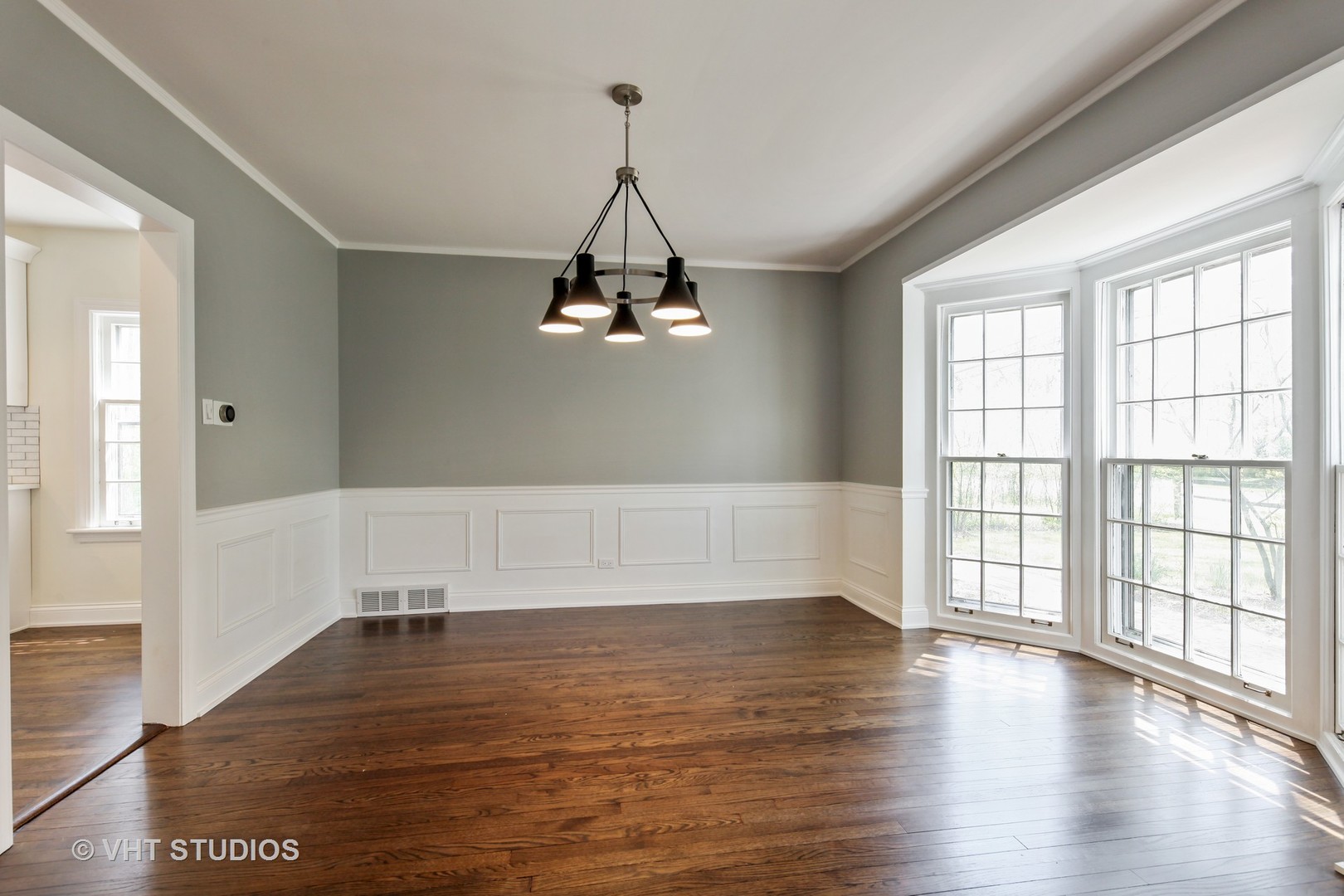 1729 Berkeley Road Highland Park, IL 60035 - Photo 8 of 25 a view of empty room with wooden floor and fan