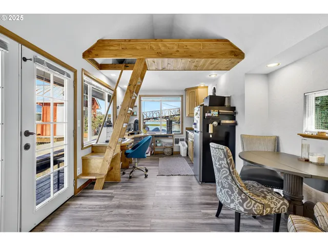 a view of a workspace with furniture and windows