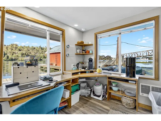 a kitchen with stainless steel appliances granite countertop a refrigerator a sink and a stove