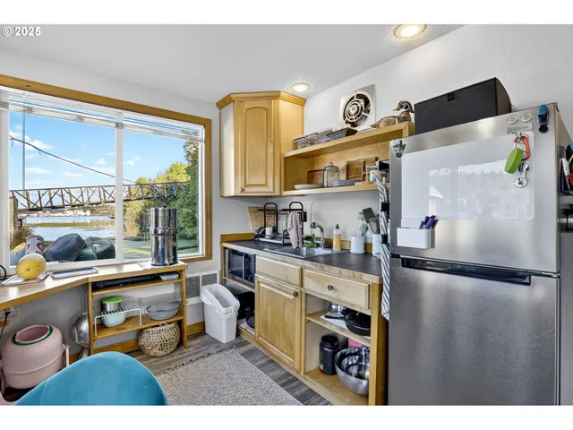 a kitchen with stainless steel appliances granite countertop a sink and cabinets