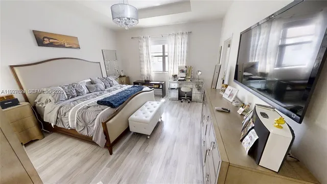 a bedroom with double bed and a window