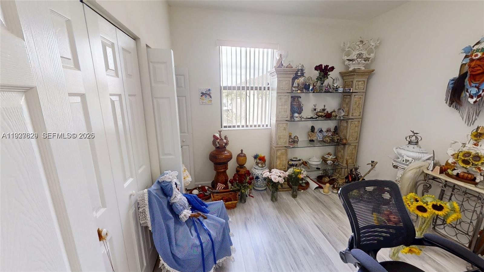 4231 Southwest 165th Court Miami, FL 33185 - Photo 31 of 39 a living room with furniture windows and wooden floor