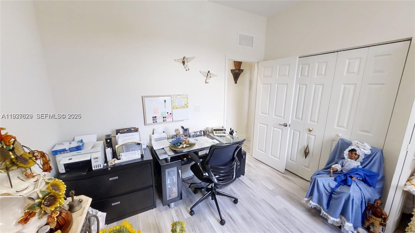 4231 Southwest 165th Court Miami, FL 33185 - Photo 32 of 39 a view of a workspace with furniture and a rug