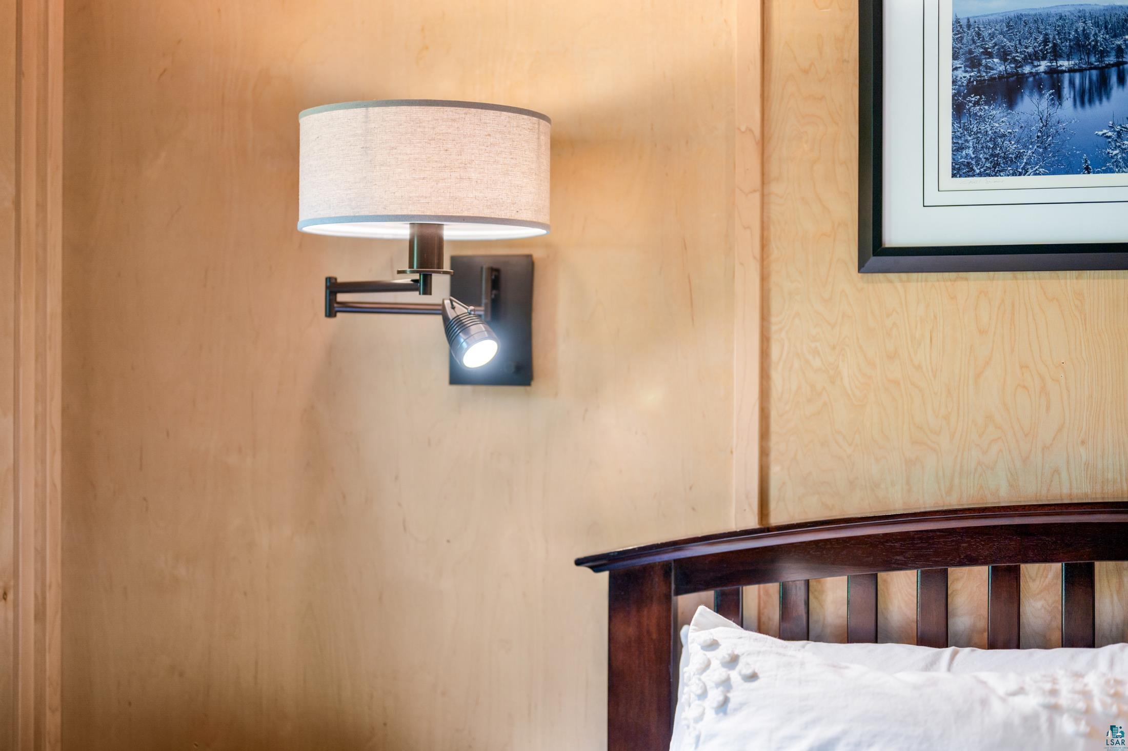 3778 East County Road Barnum, MN 55707 - Photo 23 of 52 Wood-finish wall paneling with a mounted swing-arm light fixture