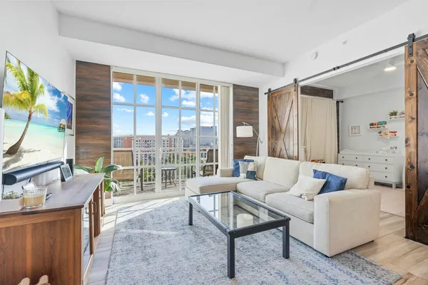 a living room with furniture and a large window