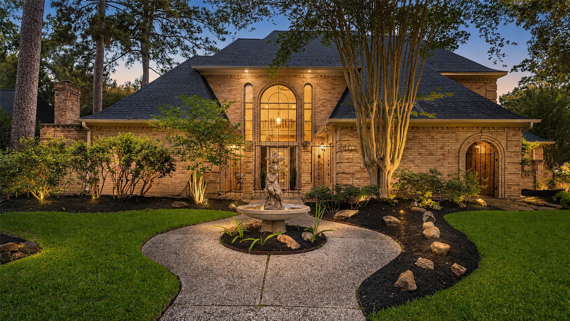 2607 Laurel Ridge Drive Houston, TX 77345 - Photo 1 of 47 a building with trees in the background