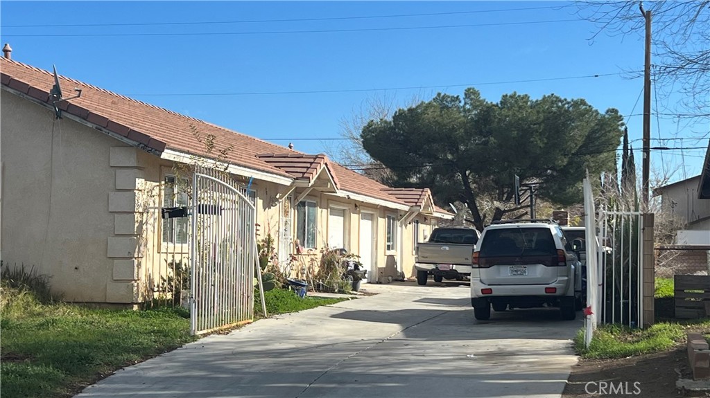 38726 4th Palmdale, CA 93550 - Photo 2 of 7 a view of a car park in front of a house