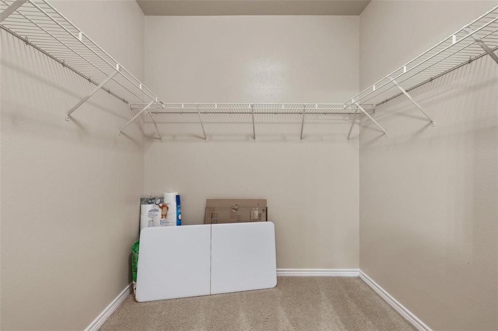 3102 Kings Road, Unit 1303 Dallas, TX 75219 - Photo 16 of 25 a view of storage and utility room with racks on the wall