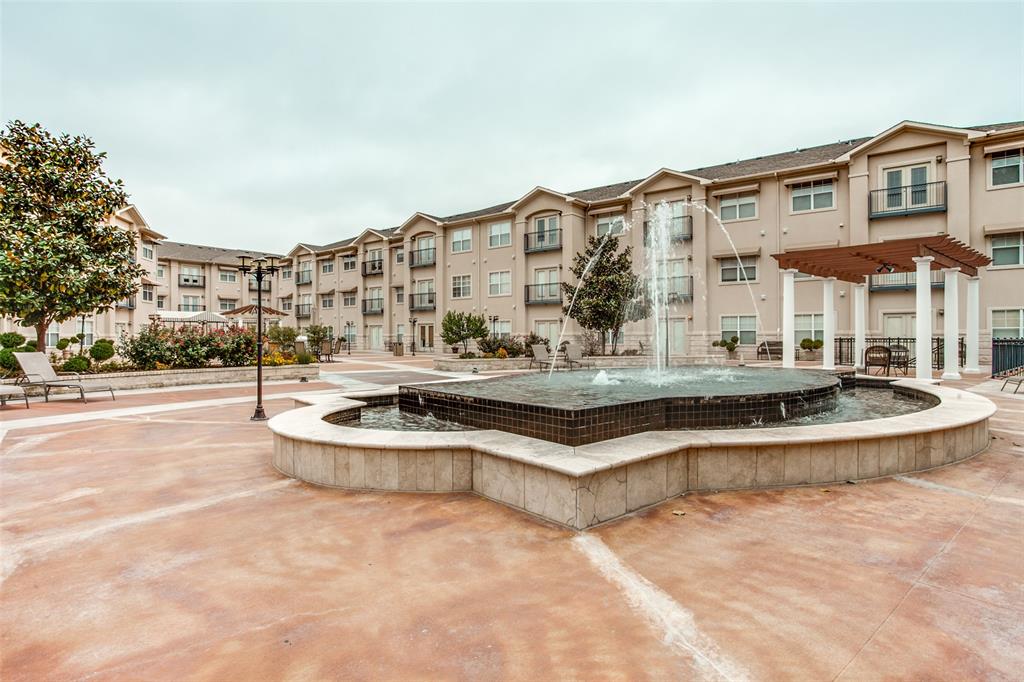 3102 Kings Road, Unit 1303 Dallas, TX 75219 - Photo 21 of 25 a view of a building with pool and trees in the background