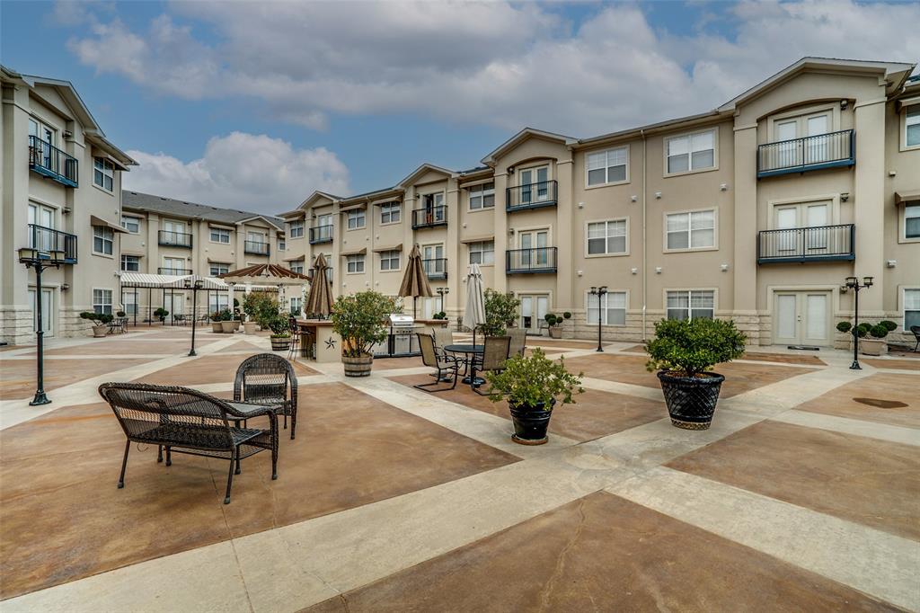 3102 Kings Road, Unit 1303 Dallas, TX 75219 - Photo 23 of 25 a front view of a building with sitting area